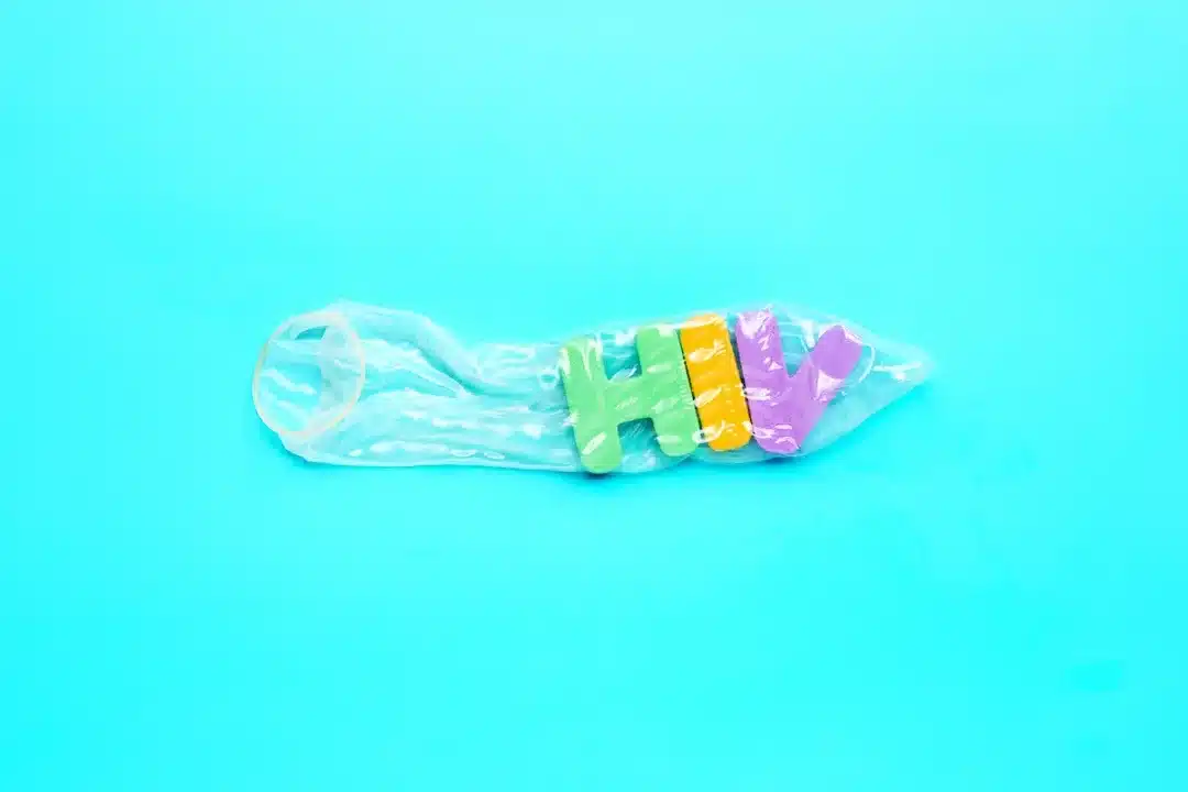 Condom,With,"hiv",Colorful,Alphabet,On,Blue,Background.,Safe,Sex