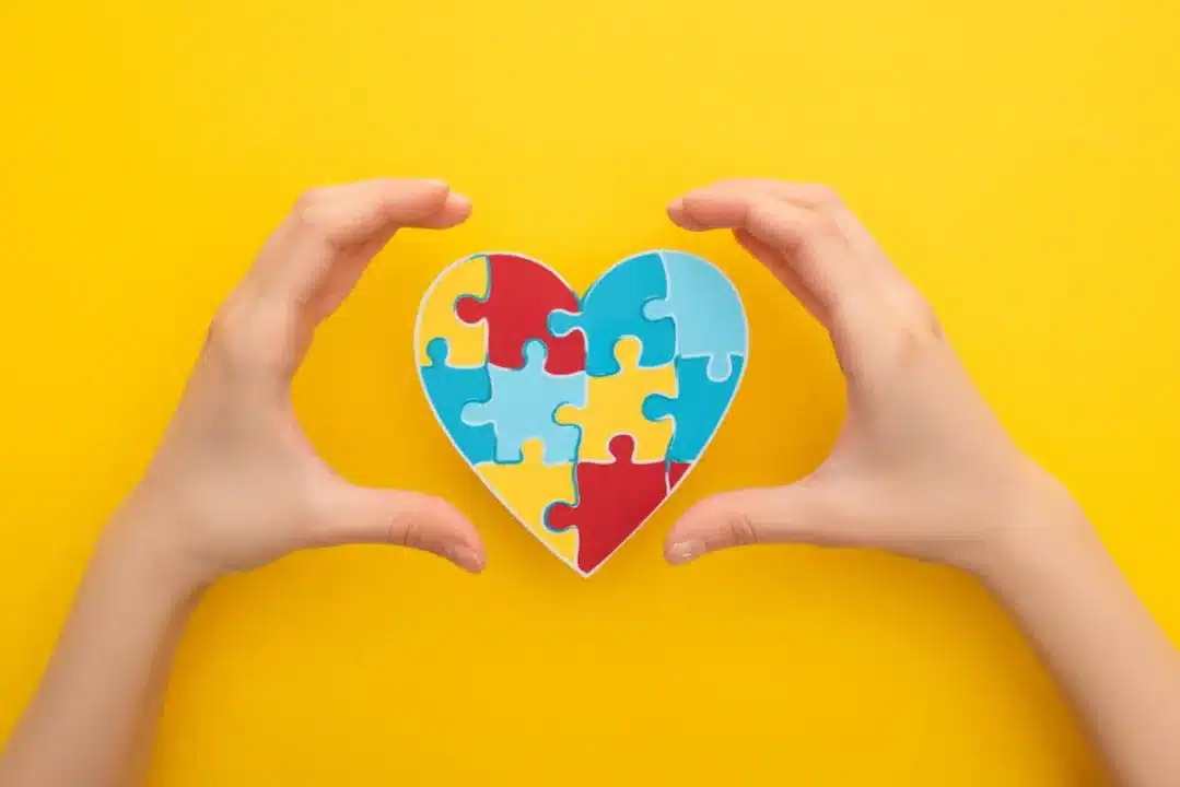 Cropped,View,Of,Female,Hands,With,Puzzle,Heart,On,Yellow