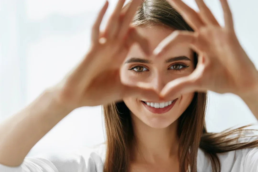 Healthy,Eyes,And,Vision.,Portrait,Of,Beautiful,Happy,Woman,Holding